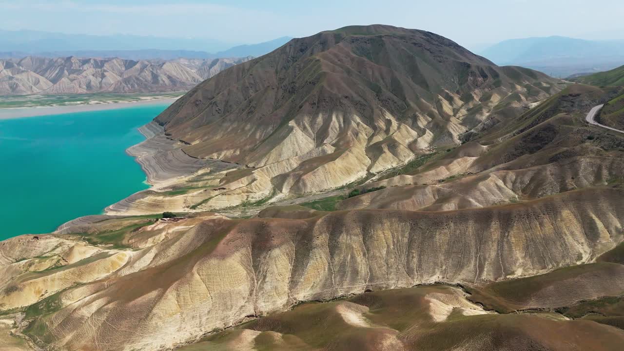 drone approach Kyrgyzstan Toktogul lake dreamy landscape in Central Asia aerial cinematic