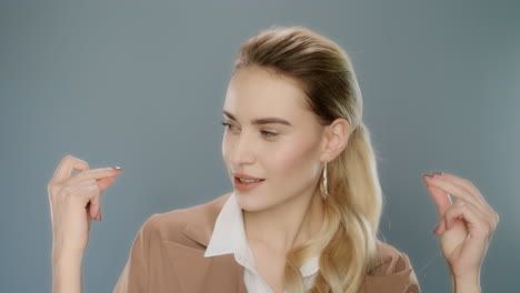 young business woman snapping fingers. cheerful woman clicking fingers