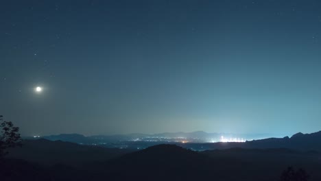 time lapse in 4k video. the phenomenon of star arrangement (saturn, moon, venus, jupiter) in the misty night sky on a hill, long exposure, mae moh, lampang, thailand.