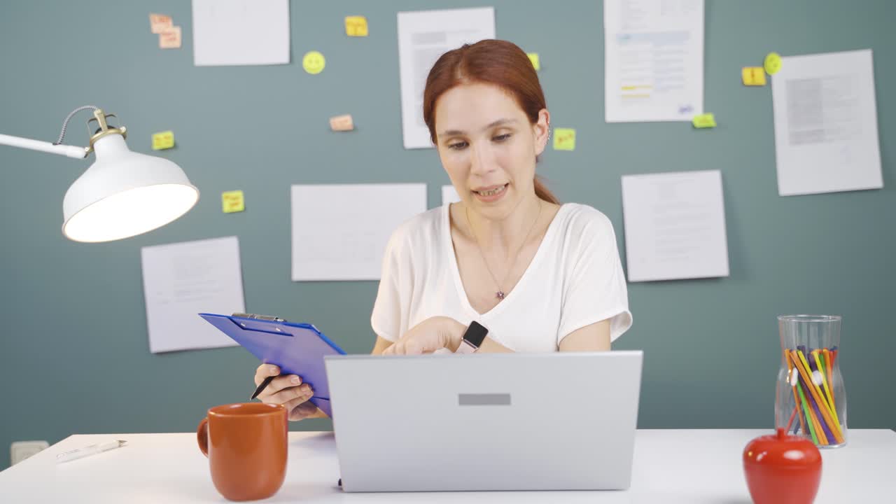 Woman making video call on laptop.