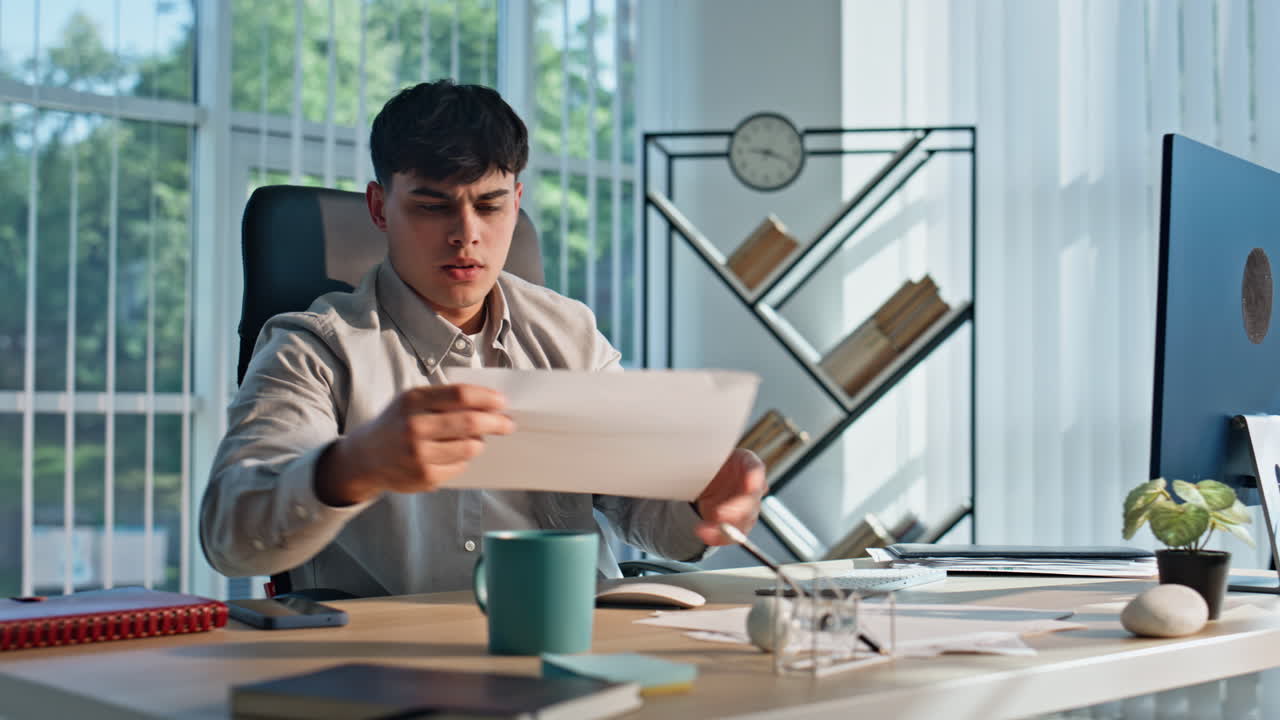 Inspired creator working computer office interior closeup. Guy examining renders