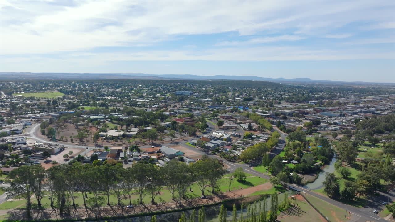 Aerial: Drone shot of a green leafy area of Griffith town, NSW Australia
