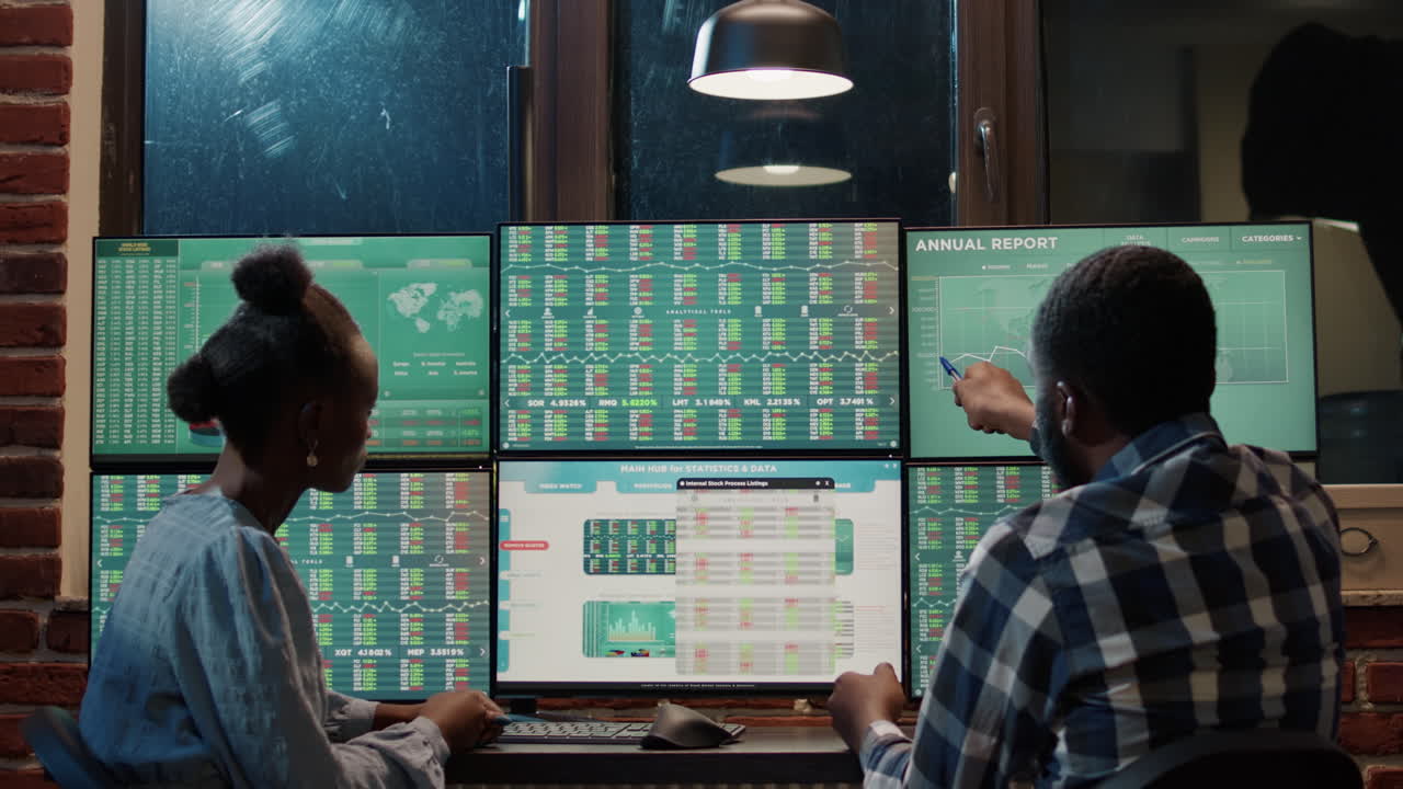 Man and woman doing teamwork on financial stock market statistics