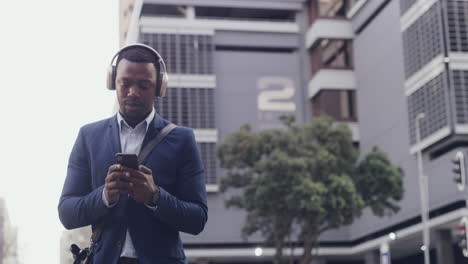 Handsome,-man-or-businessman-on-headphones-walking