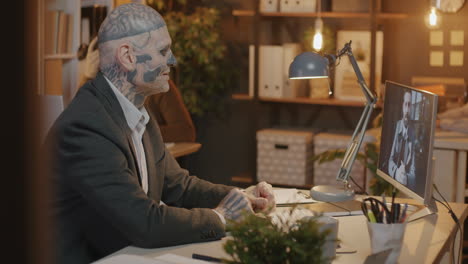 business meeting with a tattooed man