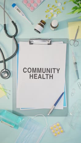 vertical video of community health written on medical paper