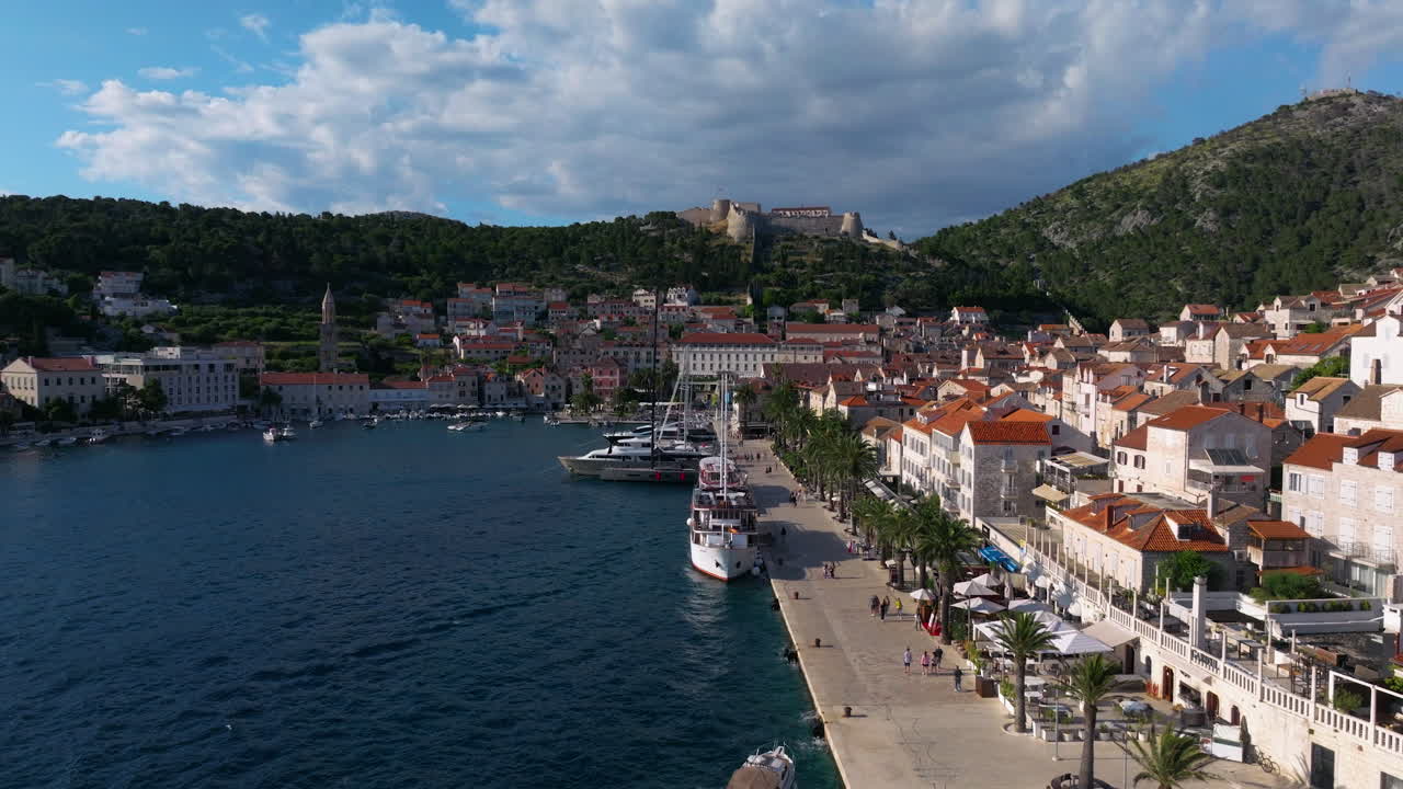 Waterfront Town Of Hvar And Promenade In Hvar Island, Croatia. - aerial shot