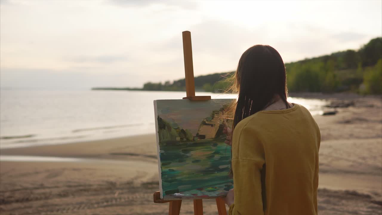 Woman Painting Landscape at Sunset Beach