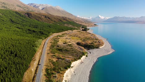 scenic winding road to mount cook national park, new zealand