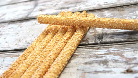 Bread-sticks-arranged-on-wooden-table