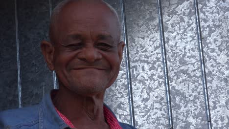 a friendly old man smiles in trinidad cuba