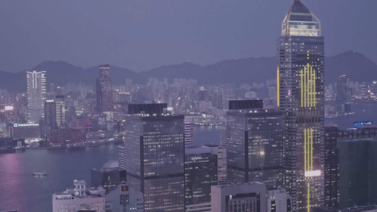 Central Plaza skyscraper in the Hong Kong city skyline at night. Aerial drone view