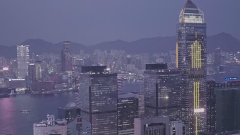 central plaza skyscraper in the hong kong city skyline at night. aerial drone view