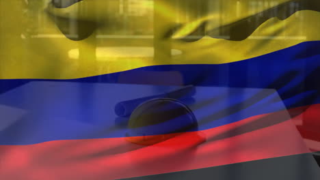 animation of flag of colombia waving over yellow helmet and floor plan on table against glass window