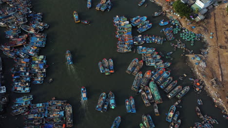 aerial drone ascent revealing over populated fisherman town of la gi in south vietnam