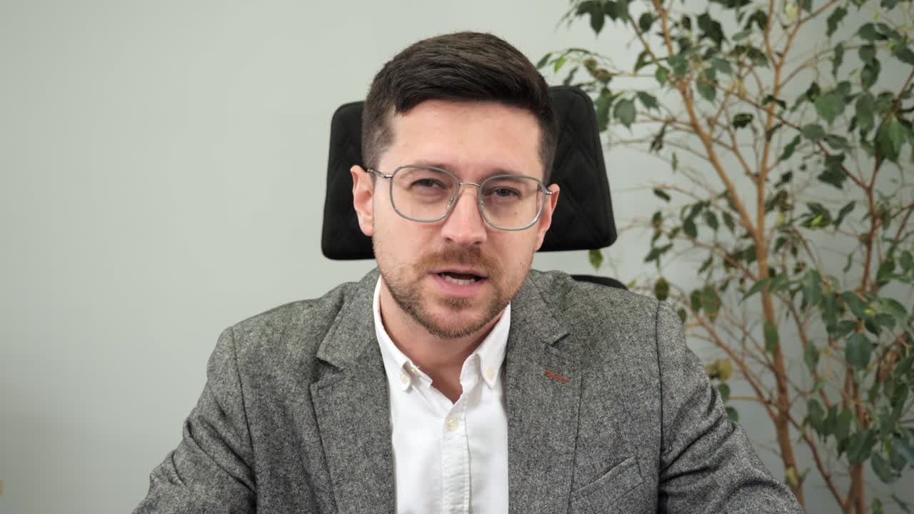 Happy energetic business man, teacher talking to web cam on conference video call. Smiling businessman coach laughing, looking camera during webinar, online class, virtual meeting. Webcam laptop view.