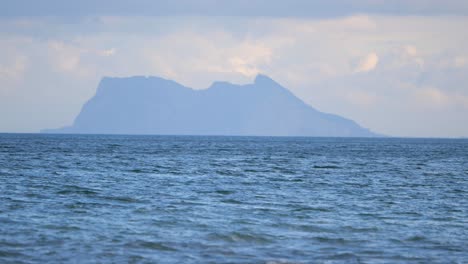 scenic view of mediterranean sea with splashing waves on la rada beach in estepona, spain