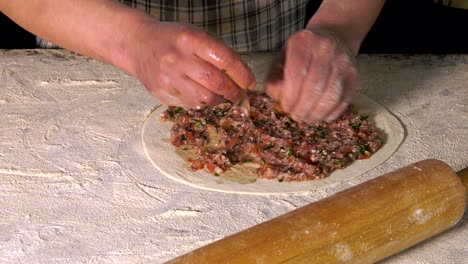 making turkish food pide lahmacun