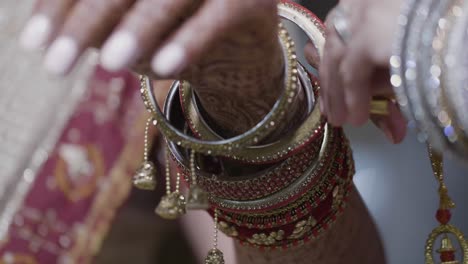 indian bride wearing bangles accessories during wedding day