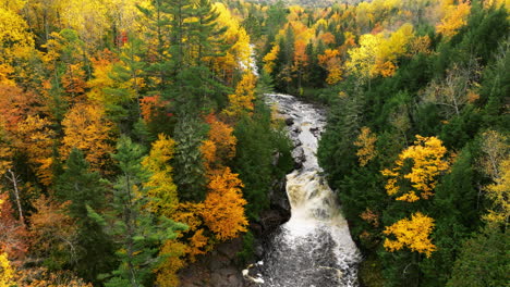 A-drone-shot-of-the-hard-to-get-to-Sturgeon-River-falls-in-full-autumn-color