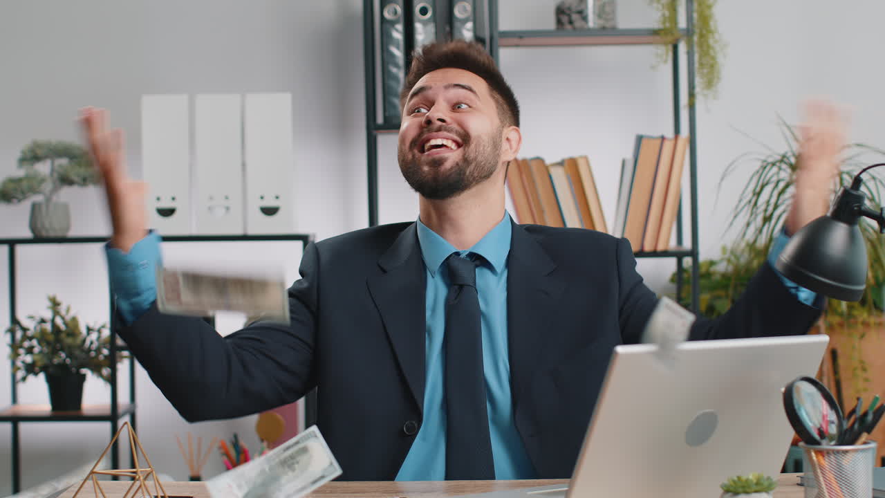 Money cash dollar rain falling on adult office business man celebrating success winning career grow