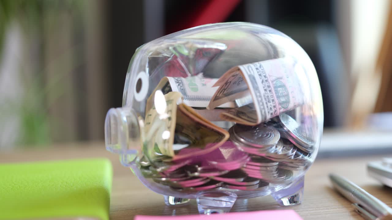 Clear Piggy Bank Filled with Money