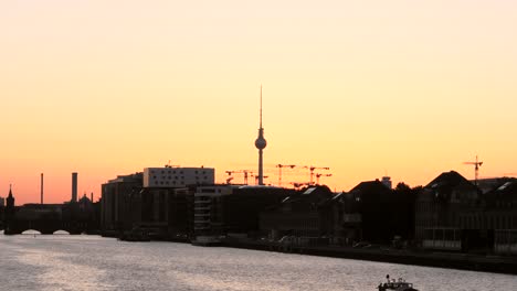 sunset over silhouetted berlin skyline