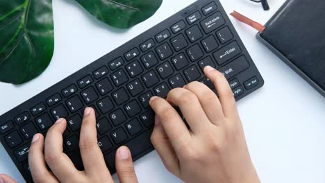 hands typing on a keyboard