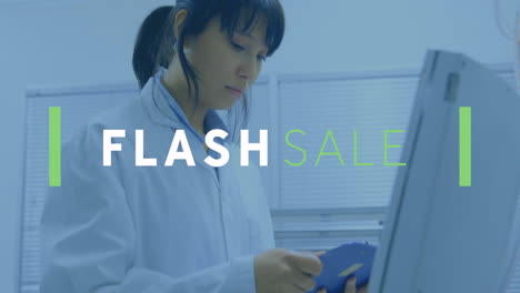 working in lab coat, woman creating animation with flash sale text overlay