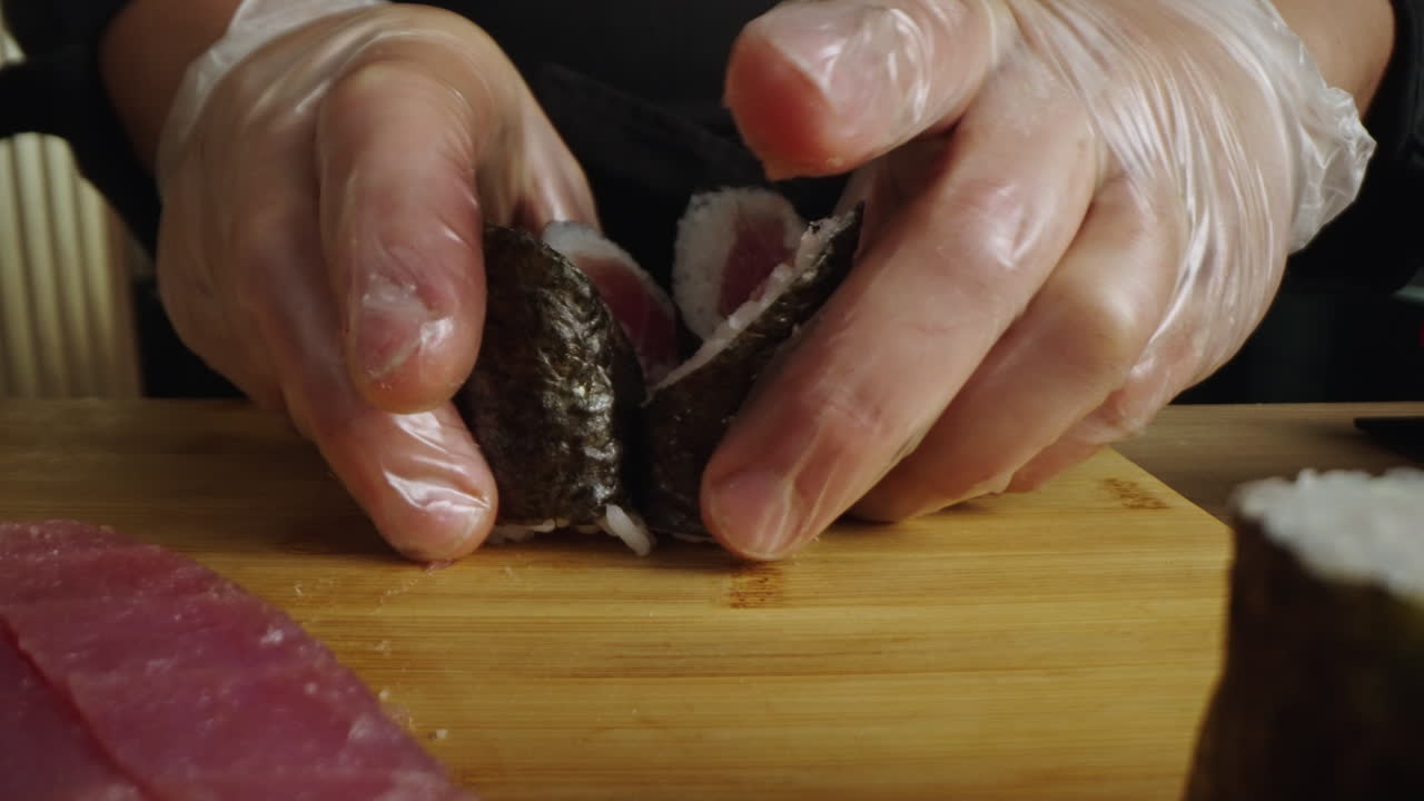 Close-up of a Chef Preparing Sushi Rolls