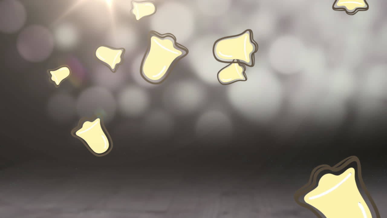 Animazione di campane che cadono su luci sfocate e scintillanti