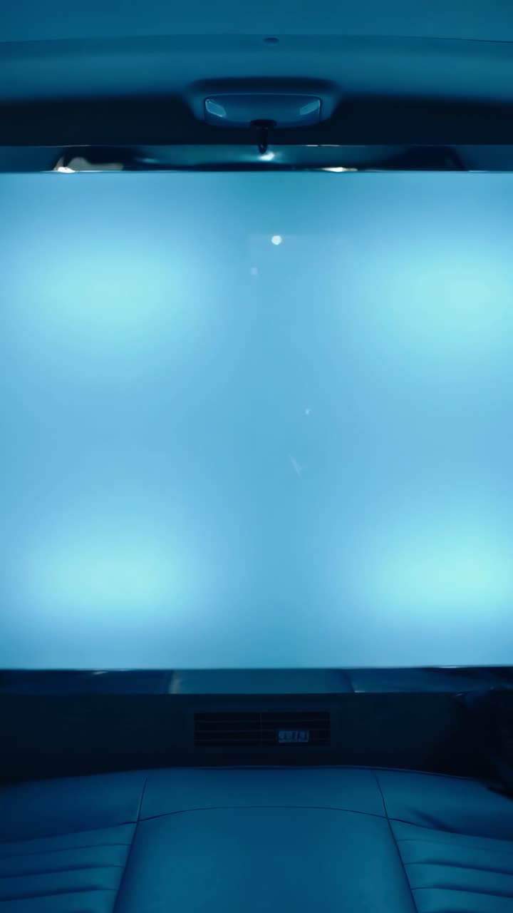 Modern Car Interior with Blue Lighted Ceiling Panel