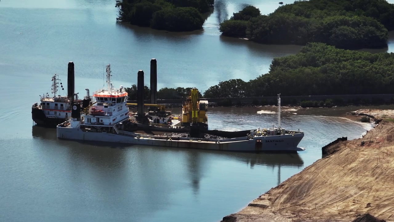 Split Hopper Dredger At Work On Mexican Coastline In Manzanillo, Colima, Mexico. aerial