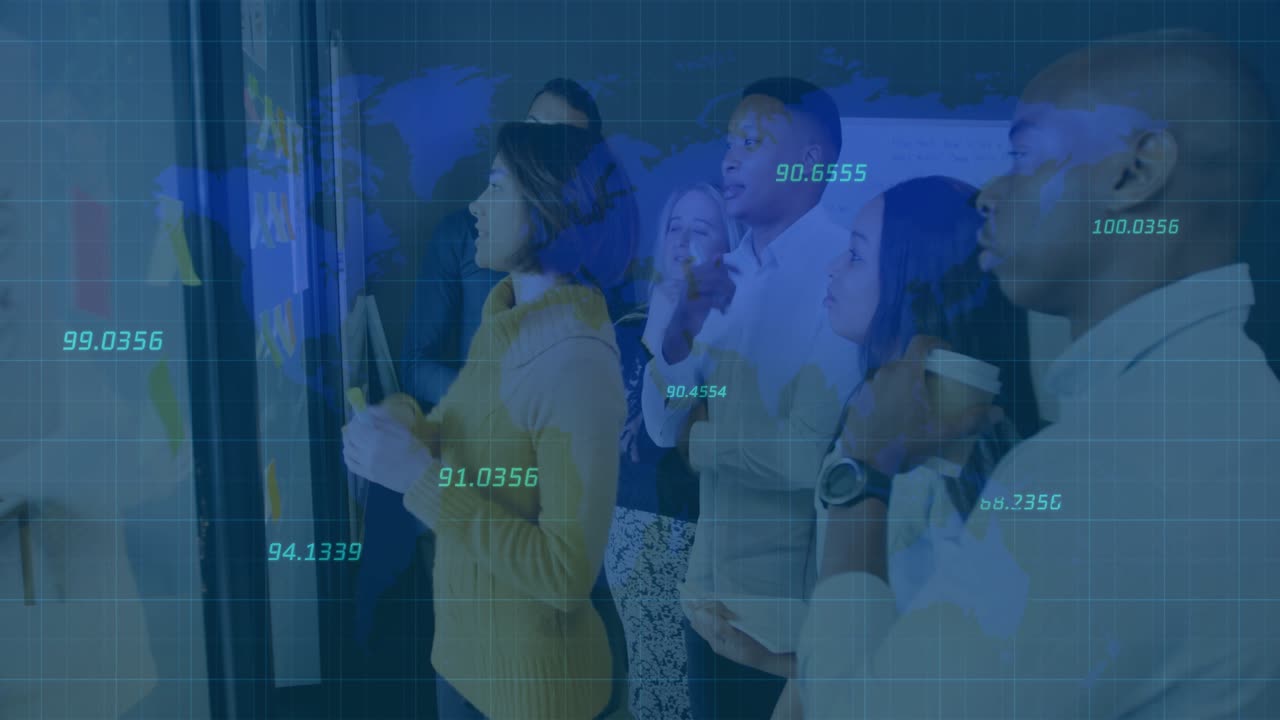 Presenter picking yellow sticky note from glass wall and rearranging ideas in brainstorming session