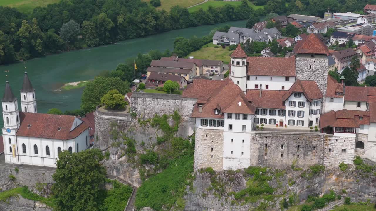 Drone view of Aarburg Fortress and the church surrounded by rooftops and greenery