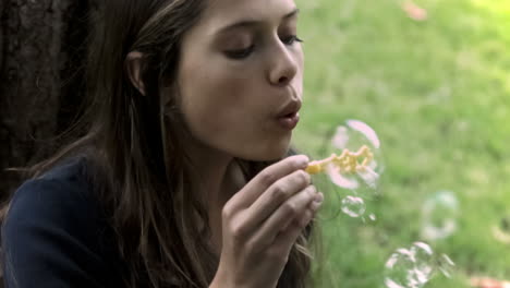 Brunette-making-bubbles-in-slow-motion