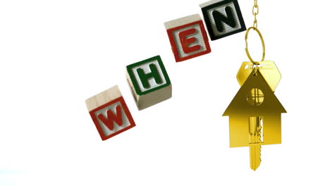 animation of wooden blocks with text when and golden house shape with key on white background