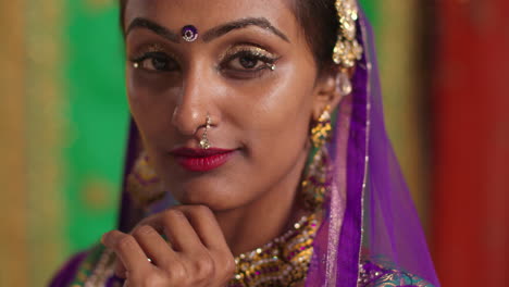 Close-Up-Portrait-Of-Female-Kathak-Dancer-Performing-Dance-Wearing-Traditional-Indian-Dress-And-Jewellery-Looking-At-Camera-2