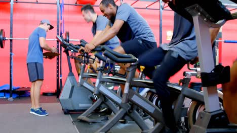 Athletes-working-out-on-exercise-bike-4k