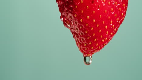 close-up of a dropping strawberry