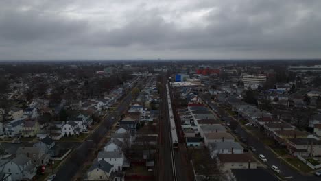 an aerial view of a long island railroad train traveling on a cloudy day
