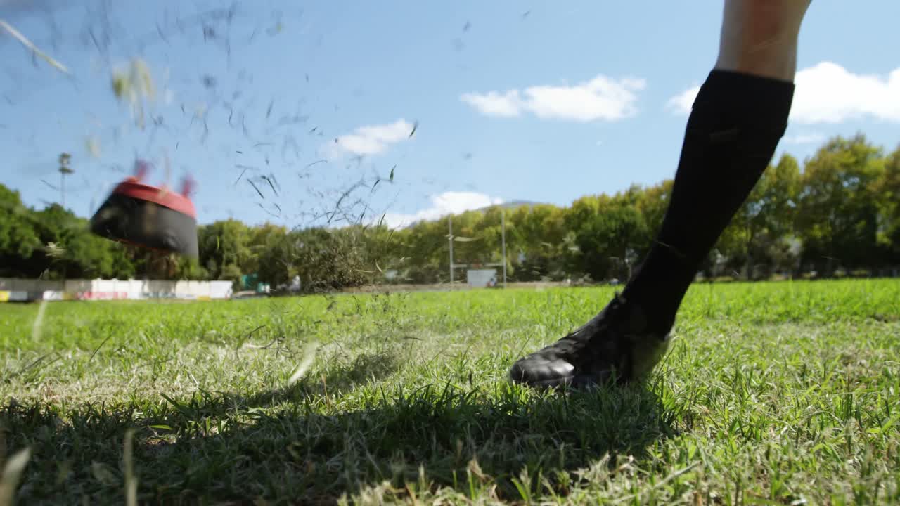Rugby player kicking the oval ball 4K 4k