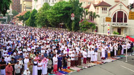 indonesian muslims pray together near church