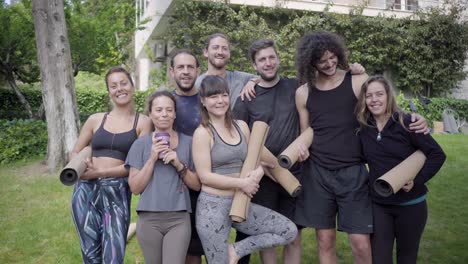 yoga group smiling at camera outdoor