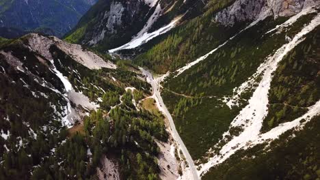 Drone-shot-of-Vrsic-Pass,-Slovenia,-on-a-sunny-day-with-some-clouds