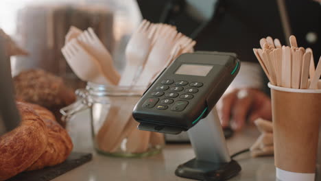 close up customer paying using smartphone buying coffee in cafe happy customer enjoying service spending money at restaurant