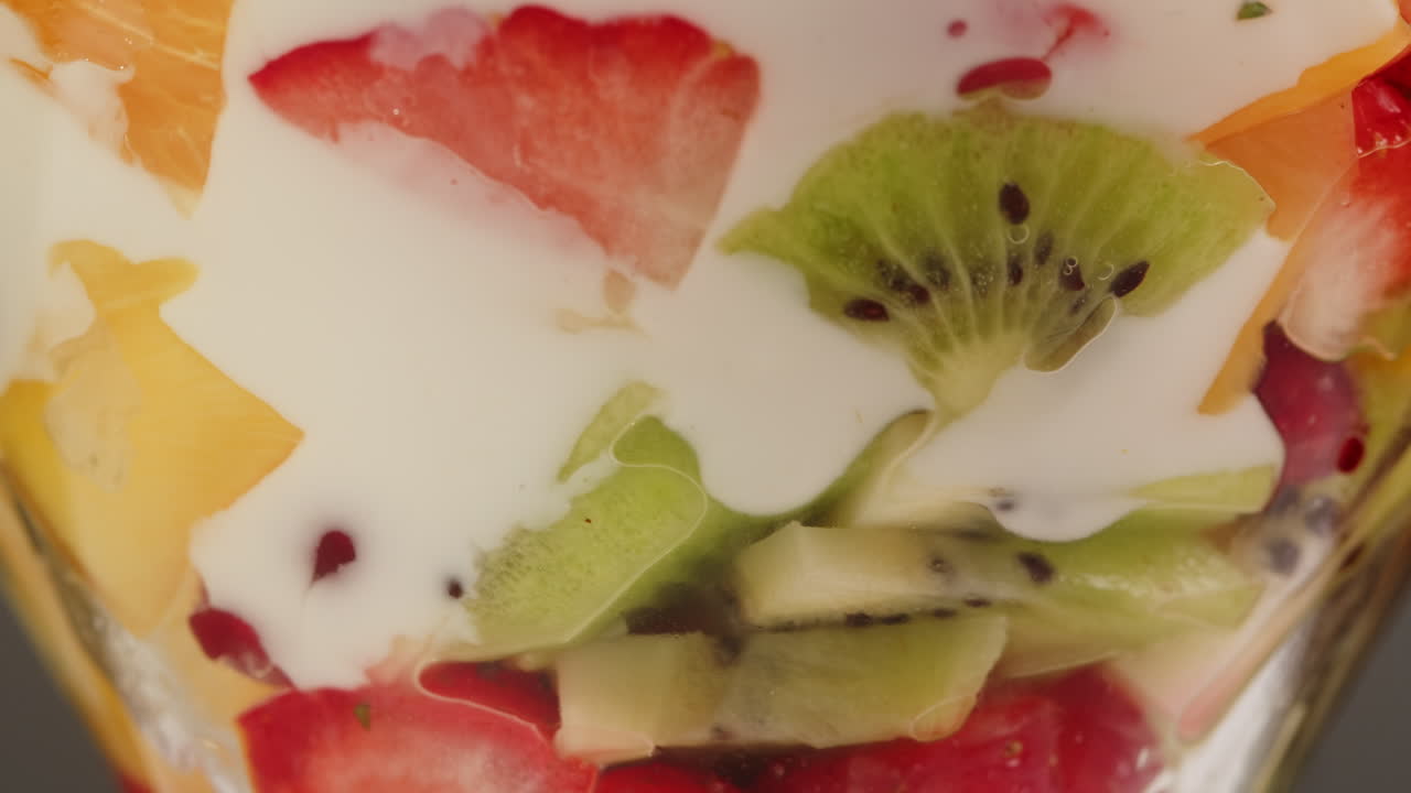 Creamy Yogurt Poured Over Colorful Fresh Fruit Salad