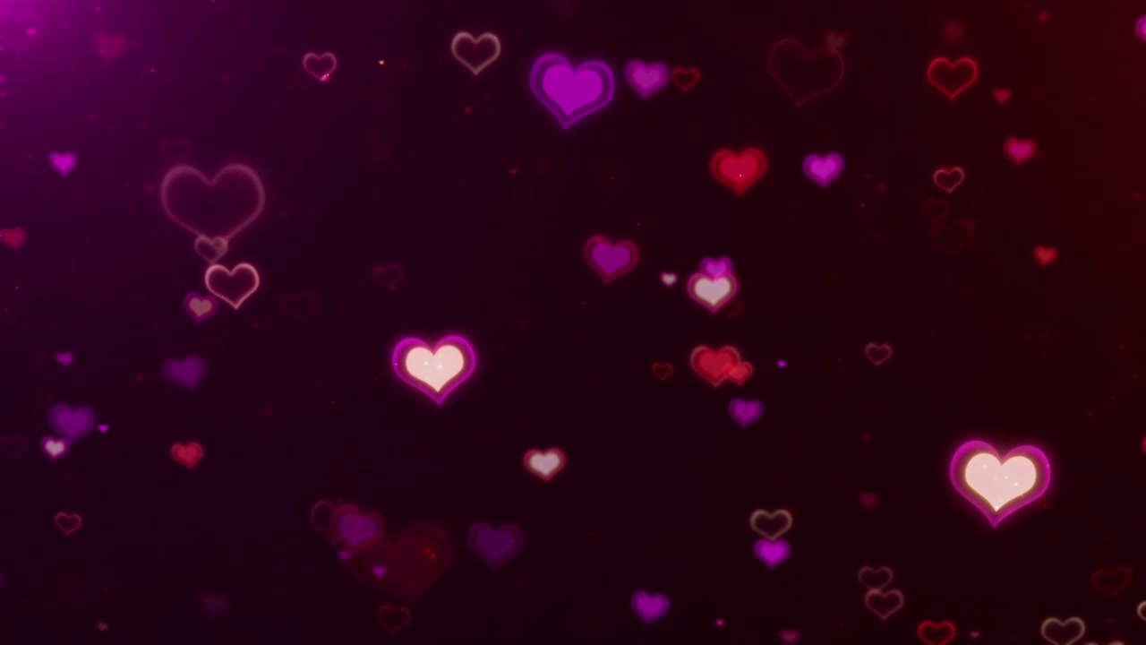 Immagine animata bokeh a forma di cuore di San Valentino con cuori rossi luminosi, particelle magenta, sfocatura morbida e atmosfera romantica.
