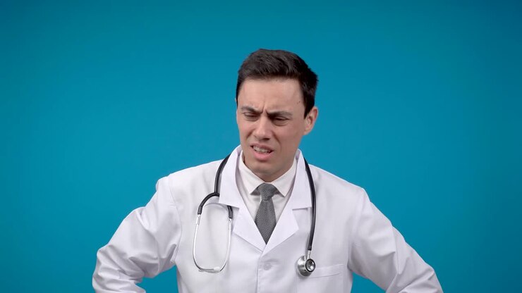 Doctor experiencing pain or discomfort