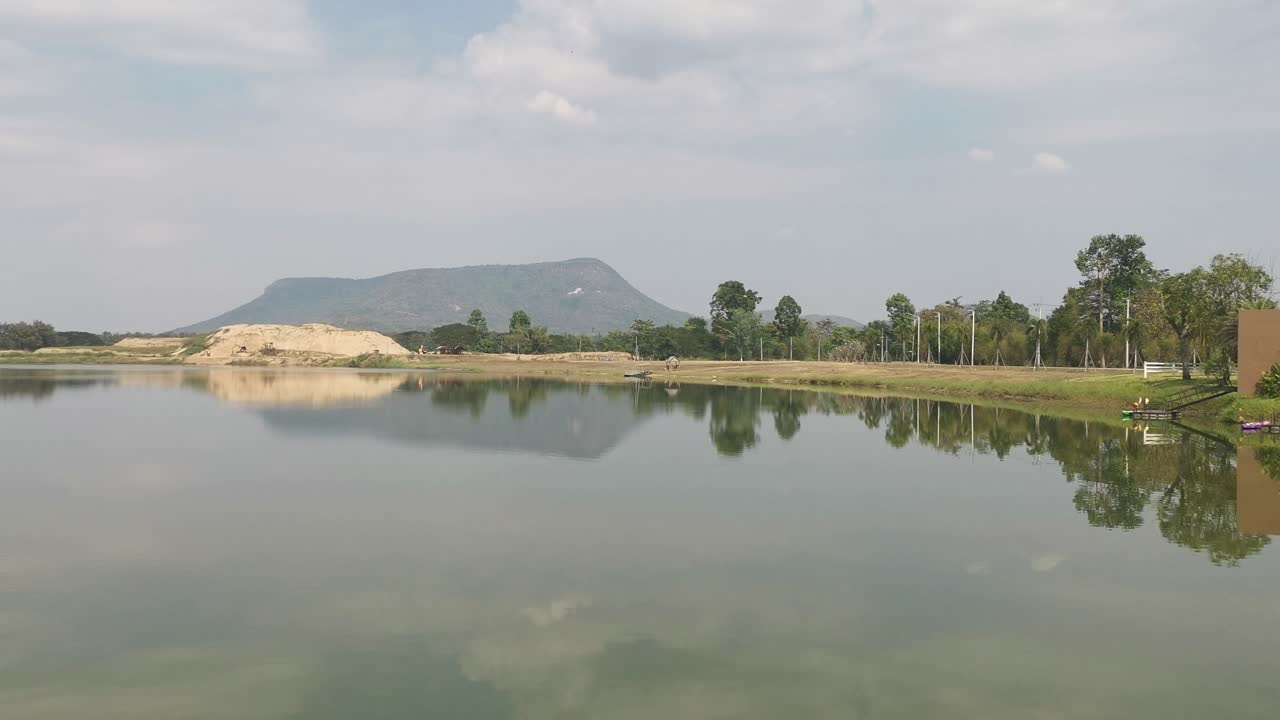 Thailand Landscape Lake Reflections with Scenic Views on a Calm Summer's Day with Blue Skies